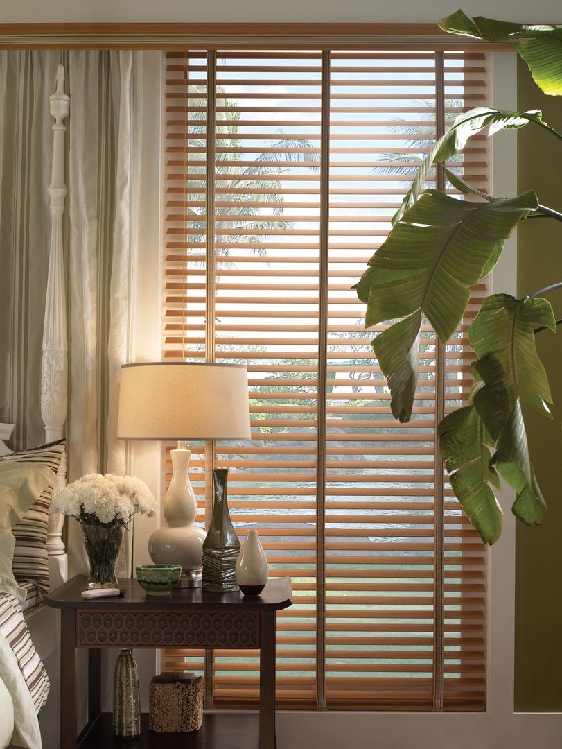 Lamp in front of wooden blinds